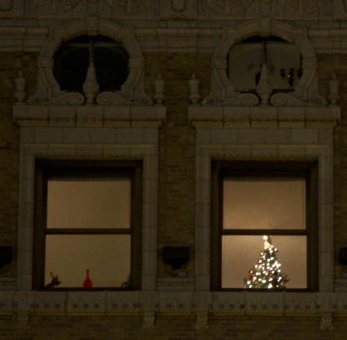 William d Lewis The Vindicator  A christmas tree is shown in hte window of a downtown apartment building.