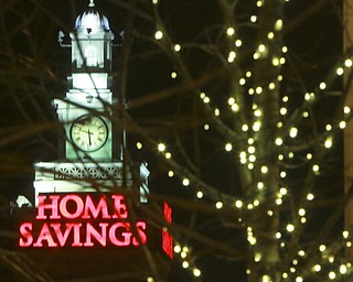William d Lewis The Vindicator Home SavingsClock tower with holiday lightsin foreground.
