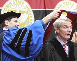 William D. Lewis the Vindicator US Sen Rob Portman is awarded honorary degree by YSU Provost Martin Abraham during 12132015 commencement . Portman was speaker.