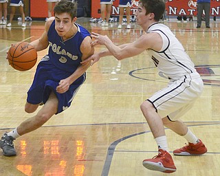 Katie Rickman | The Vindicator.Poland's Mike Bojdos (#3) moves around Fitch's Scotty Duffy (#3) during the second period of the game at Fitch High School on Tuesday night.
