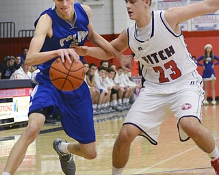 Katie Rickman | The Vindicator.Poland's Matt Baker (#11) shoots a basket and scores against Fitch's Dom DeFrancesio (SPELLING) (#23) during the fourth period of the game at Fitch High School on Tuesday night.