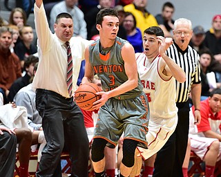 LEAVITTSBURG, OHIO - DECEMBER 22, 2015: Jaden Walton #3 of Newton Falls attempts to find a teammate to pass the ball to while being pressured from behind by Jason Downey #23 of Labrae during the 1st half of their game Tuesday night at Labrae High School. DAVID DERMER | THE VINDICATOR