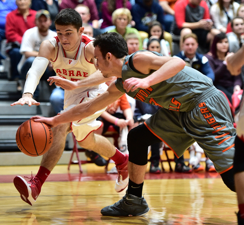 LEAVITTSBURG, OHIO - DECEMBER 22, 2015: Jason Downey #23 of Labrae and Jaden Walton #3 of Newton Falls battle for a loose ball near the baseline during the 1st half of their game Tuesday night at Labrae High School. DAVID DERMER | THE VINDICATOR