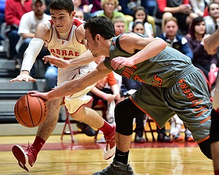 LEAVITTSBURG, OHIO - DECEMBER 22, 2015: Jason Downey #23 of Labrae and Jaden Walton #3 of Newton Falls battle for a loose ball near the baseline during the 1st half of their game Tuesday night at Labrae High School. DAVID DERMER | THE VINDICATOR