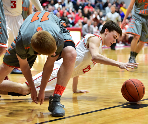 LEAVITTSBURG, OHIO - DECEMBER 22, 2015: Aaron Iler #12 of Labrae crawls on the ground while reaching for the ball after Joey Urso #11 of Newton Falls failed to gain possession of a rebound during the 1st half of their game Tuesday night at Labrae High School. DAVID DERMER | THE VINDICATOR