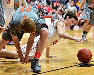 LEAVITTSBURG, OHIO - DECEMBER 22, 2015: Aaron Iler #12 of Labrae crawls on the ground while reaching for the ball after Joey Urso #11 of Newton Falls failed to gain possession of a rebound during the 1st half of their game Tuesday night at Labrae High School. DAVID DERMER | THE VINDICATOR