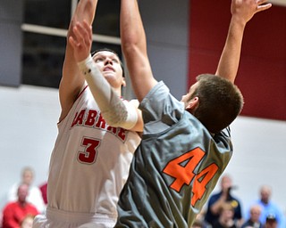 LEAVITTSBURG, OHIO - DECEMBER 22, 2015: Grant Sprague #3 of Labrae puts up a shot over Vince Dragich #44 of Newton Falls during the 1st half of their game Tuesday night at Labrae High School. DAVID DERMER | THE VINDICATOR