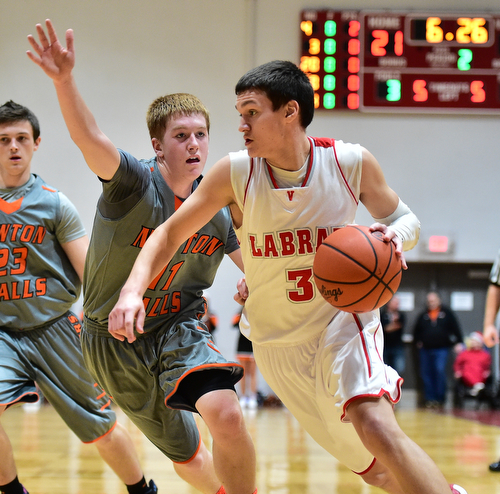 LEAVITTSBURG, OHIO - DECEMBER 22, 2015: Grant Sprague #3 of Labrae drives to the basket inside of Joey Urso #11 of Newton Falls during the 1st half of their game Tuesday night at Labrae High School. DAVID DERMER | THE VINDICATOR