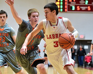 LEAVITTSBURG, OHIO - DECEMBER 22, 2015: Grant Sprague #3 of Labrae drives to the basket inside of Joey Urso #11 of Newton Falls during the 1st half of their game Tuesday night at Labrae High School. DAVID DERMER | THE VINDICATOR
