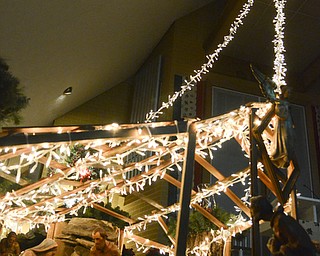 Katie Ricman | The Vindicator.The lights from the manger scene stretch to the altar to the ceiling at St. Catherine Church in Lake Milton on December 22, 2015.