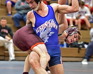 HOWLAND, OHIO - DECEMBER 23, 2015: Adam Green of Fitch kicks out the leg and isolates the arm of Carlo DeNiro of Boardman during a 160lb bout Wednesday afternoon at Howland High School. DAVID DERMER | THE VINDICATOR