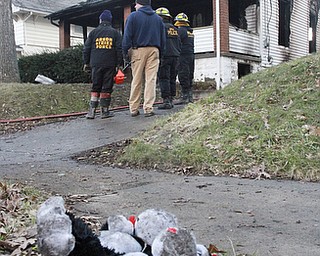 William D Lewis The Vindicator A stuffed animal on hte ground near a Powerwsway housefire where 3 people died including a young girl. 3-30-15.