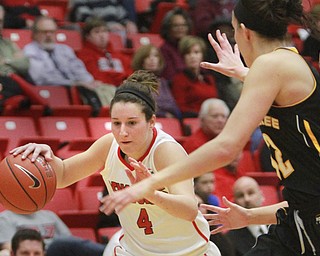 William D Lewis The Vindicator   YSU's Nikki Arbanas(4) drives around Milwaukee's Steph Kostowicz(32) during 1-7-16 action at YSU