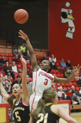 William d Lewis the vindicator  YSU's Indyia Benjamin(3) shoots past Milwaukee's Alexis Lindstrom(5).