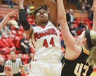 William d Lewis The vindicator YSU's Janae Jackson(44) shoots past Milwaukee's Christina Wakeman(43).