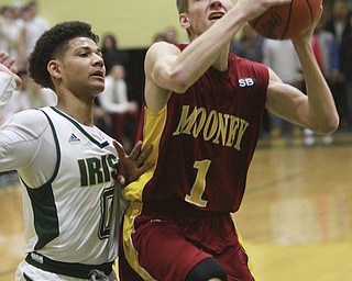 William D Lewis The VindicatorMooney's Pat Pelini1) keeps the ball from Ursuline's Mike Hughes(0)