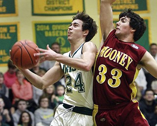 William D Lewis The Vindicator  Ursuline's Greg Parella(24) shoots past Mooney's Armon Nasseri(33) during 1-8-16 game at Ursuline.