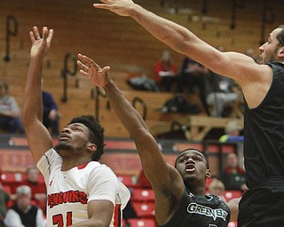 William D Lewis the vindicator YSU's Cameron Morse(24) and Green Bays Khalil small(3) and Kenneth Lowe(45)during 1-9-16 game at YSU.
