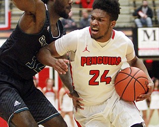 William D Lewis the vindicator YSU's Cameron Morse(24) drivesw around Greenbay's Tevin Findlay (32)during 1-9-16 game at YSU.