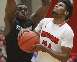 William D Lewis the vindicator YSU's Cameron Morse(24) goes the hoop past Greenbay's CharlesCooper(34) during 1-9-16 game at YSU.