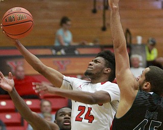William D Lewis the vindicator YSU's Cameron Morse(24) shoots  past GB's Kenneth Lowe(45) during 1-9-16 game at YSU.