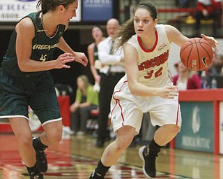 William D Lewis the vindicator  YSU's Jenna Hirsch(32) drives around Green Bay'sKaili Lukan(4) during 1-9-16 game at YSU.