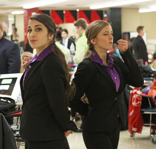 Briana Davis (right) and Marina Merlo (left) of Columbiana High School run through their duo interpretation of one of the Narnia novels in the cafeteria of Canfield High School during a Speech and Debate competition on Saturday morning.  Dustin Livesay  |  The Vindicator  1/9/16  Canfield.