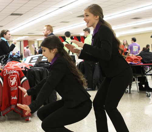 Briana Davis (right) and Marina Merlo (left) of Columbiana High School run through their duo interpretation of one of the Narnia novels in the cafeteria of Canfield High School during a Speech and Debate competition on Saturday morning.  Dustin Livesay  |  The Vindicator  1/9/16  Canfield.