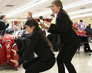 Briana Davis (right) and Marina Merlo (left) of Columbiana High School run through their duo interpretation of one of the Narnia novels in the cafeteria of Canfield High School during a Speech and Debate competition on Saturday morning.  Dustin Livesay  |  The Vindicator  1/9/16  Canfield.