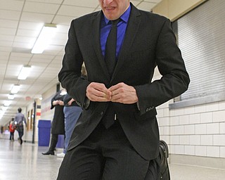 Gino Ginetti of Cardinal Mooney High School drops to his knees as he runs through his dramatic speech in the cafeteria of Canfield High School during a Speech and Debate competition on Saturday morning.  Dustin Livesay  |  The Vindicator  1/9/16  Canfield.