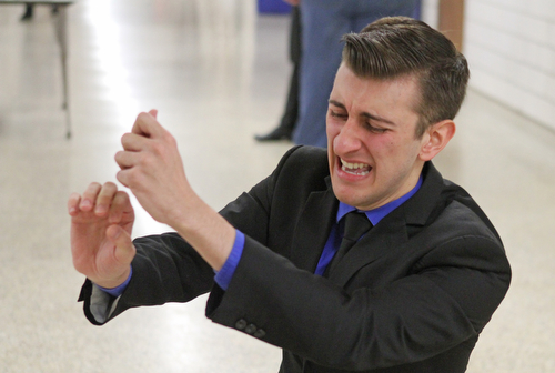 Gino Ginetti of Cardinal Mooney High School runs through his dramatic speech in the cafeteria of Canfield High School during a Speech and Debate competition on Saturday morning.  Dustin Livesay  |  The Vindicator  1/9/16  Canfield.