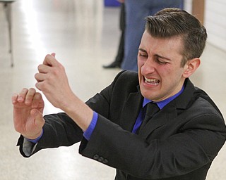Gino Ginetti of Cardinal Mooney High School runs through his dramatic speech in the cafeteria of Canfield High School during a Speech and Debate competition on Saturday morning.  Dustin Livesay  |  The Vindicator  1/9/16  Canfield.