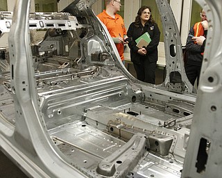       .   ROBERT K. YOSAY  | THE VINDICATOR..Tim Kuhns and Michelle Lambert.. talk about the weld testing.....GM Lordstown - as it ramps up to the New Generation Cruise 2016 in February....--30-...