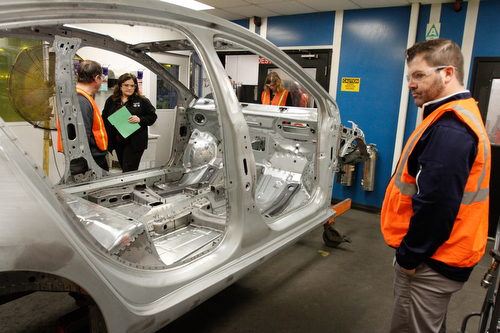       .   ROBERT K. YOSAY  | THE VINDICATOR..Michele Lambert  and Mike Polder  look over the weld inspection station....  as he finishes up a test on the welds of the new 2016- GM Lordstown - as it ramps up to the New Generation Cruise 2016 in February....--30-...