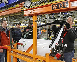       .   ROBERT K. YOSAY  | THE VINDICATOR..Brian Stevens - Patrick Fleischer - Vernon Mills-Steve Burbrink  see how the new line works as trim on a door  is installed.. ..GM Lordstown - as it ramps up to the New Generation Cruise 2016 in February....--30-...