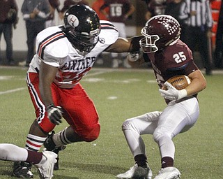 ROBERT  K. YOSAY | THE VINDICATOR
Boardman at Harding: Harding's #76 Marcquise Allgood tries to stop Boardman's #25 Mario Graziani as he makes a cut around end for a first down during second quarter action.