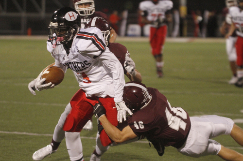ROBERT  K. YOSAY | THE VINDICATOR
Boardman at Harding: Boardman's #46 grabs #3 Marlin Richardson at the line #25 Mario Graziani during first quarter action.