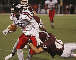 ROBERT  K. YOSAY | THE VINDICATOR
Boardman at Harding: Boardman's #46 grabs #3 Marlin Richardson at the line #25 Mario Graziani during first quarter action.