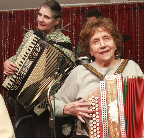 William D Lewis the Vindicator  Laurie James of Warren, left, plays an accordion while Dolores DePietro of Girard plays the button box during a Polka Jam session at Kuzman's  in Girard Friday 1-15-2016. The weekly event gives musicians and fans of polka music and opportunity to enjoy themselve