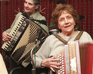 William D Lewis the Vindicator  Laurie James of Warren, left, plays an accordion while Dolores DePietro of Girard plays the button box during a Polka Jam session at Kuzman's  in Girard Friday 1-15-2016. The weekly event gives musicians and fans of polka music and opportunity to enjoy themselve