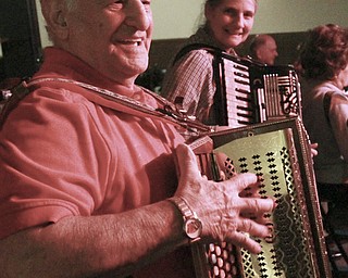 William D Lewis the Vindicator  Pete November of Warren plays the buton box while Laurie James of Warren plays the accordion during a Polka Jam session at Kuzman's  in Girard Friday 1-15-2016. The weekly event gives musicians and fans of polka music and opportunity to enjoy themselves.