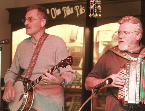 William D Lewis the Vindicator Charles Esposito plays the banjo while Joe Godina plays the button box during a Polka Jam session at Kuzman's  in Girard Friday 1-15-2016. The weekly event gives musicians and fans of polka music and opportunity to enjoy themselves.