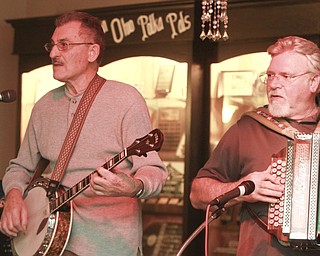 William D Lewis the Vindicator Charles Esposito plays the banjo while Joe Godina plays the button box during a Polka Jam session at Kuzman's  in Girard Friday 1-15-2016. The weekly event gives musicians and fans of polka music and opportunity to enjoy themselves.