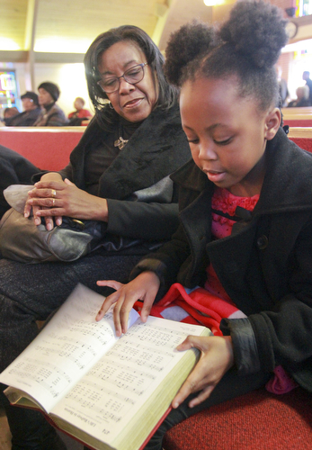 William D Lewis The Vindicator Suzette Hinson and her grandaughter Chrystiana Douglas, 6, during annual MLK jr Community Worship Service Sunday 1-17-16 at Third Baptist Church in Youngstown. they are from Youngstown.