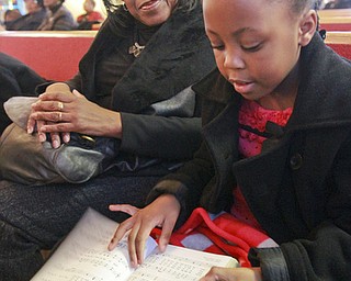 William D Lewis The Vindicator Suzette Hinson and her grandaughter Chrystiana Douglas, 6, during annual MLK jr Community Worship Service Sunday 1-17-16 at Third Baptist Church in Youngstown. they are from Youngstown.