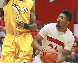 William D Lewis The Vindicator   YSU's CameronMorse(24) shoots over Valpo'sE. Victor Nickerson(1) during 1-19-16 game at YSU.