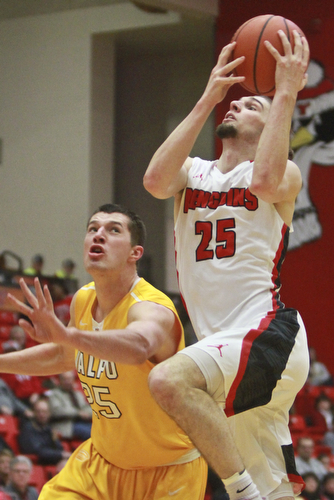 William D Lewis The Vindicator  YSU's Jprdan andrews(25) shoots over Valpo's Alec Peters(25) during 1-19-16 game at YSU.