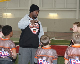 President of the Youngstown Youth Flag Football Association, Elliot Giles, talks to the 9-10 year old team during practice on Wednesday night at the WATTS.  Dustin Livesay  |   The Vindicator  1/13/16  YSU, WATTS