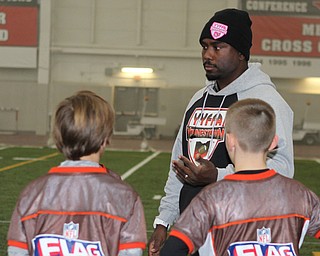 President of the Youngstown Youth Flag Football Association, Elliot Giles, talks to the 9-10 year old team during practice on Wednesday night at the WATTS.  Dustin Livesay  |   The Vindicator  1/13/16  YSU, WATTS