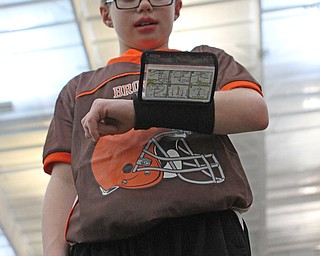 Ty Stricko looks through his plays during practice for the 9-10 year old YYFFA team on Wednesday night at the WATTS.  Dustin Livesay  |   The Vindicator  1/13/16  YSU, WATTS